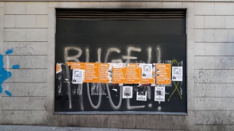 photo by @redesycalles of posters in Lavapies